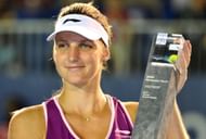 Karolina Pliskova of Czechoslovakia poses with her trophy after beating Bethanie Mattek-Sands of the United States during their women's final singles match at the BMW Malaysian Open tennis tournament in Kuala Lumpur on March 3, 2013. Pliskova won 1-6, 7-5, 6-3.
